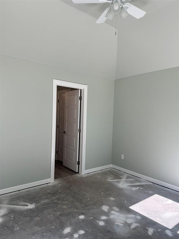 unfurnished room featuring ceiling fan and vaulted ceiling