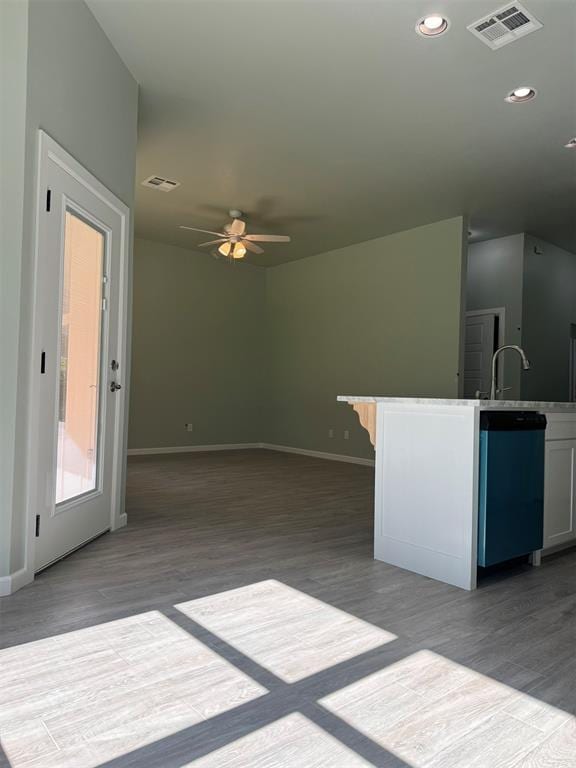 kitchen with sink, ceiling fan, dishwasher, white cabinets, and light wood-type flooring