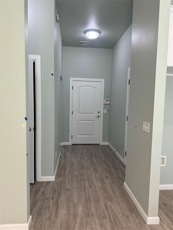 corridor with dark wood-type flooring