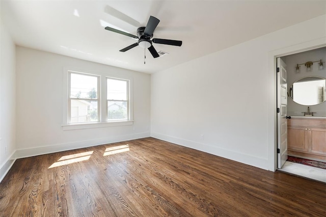 unfurnished room with ceiling fan and dark hardwood / wood-style flooring