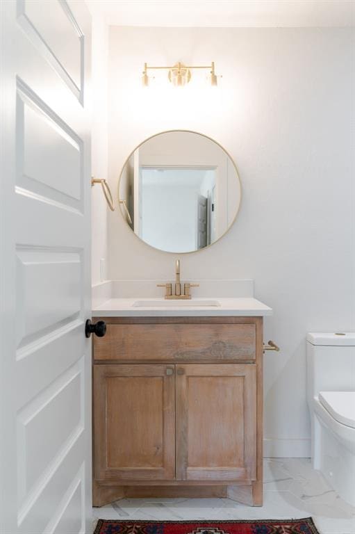 bathroom with vanity and toilet