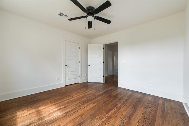 interior space with ceiling fan and dark wood-type flooring