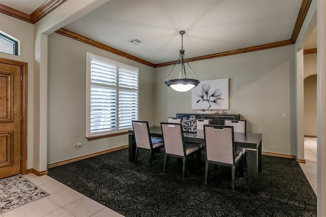 tiled dining space with crown molding