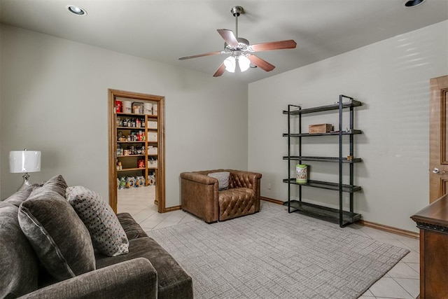 tiled living room with ceiling fan