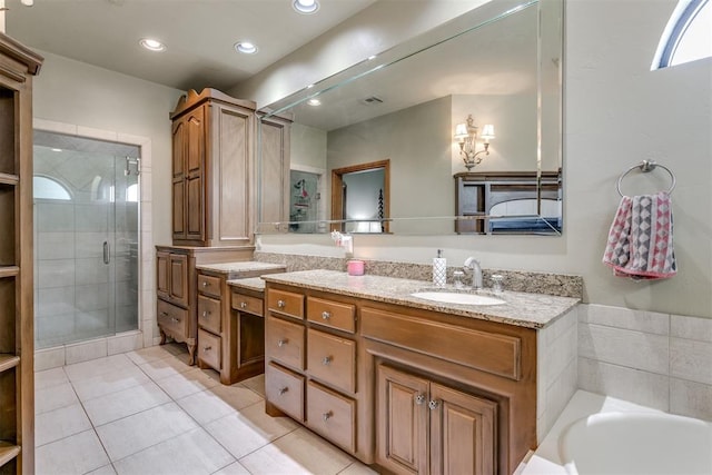 bathroom featuring tile patterned floors, vanity, and independent shower and bath