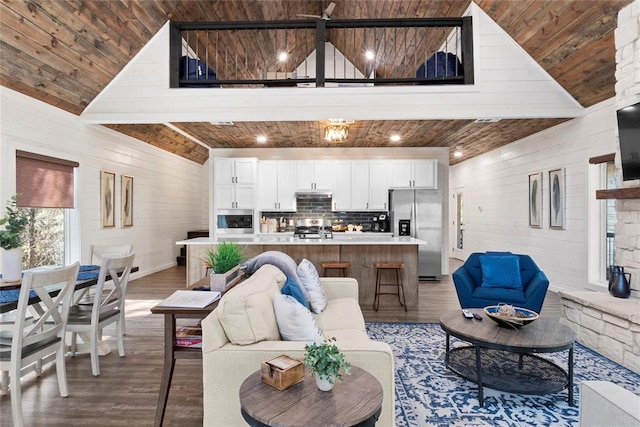 living room with hardwood / wood-style flooring, lofted ceiling with beams, and wood ceiling