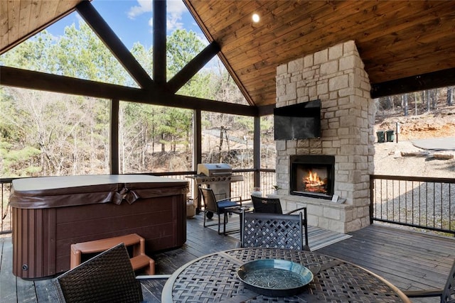 exterior space with an outdoor stone fireplace, lofted ceiling, and wooden ceiling