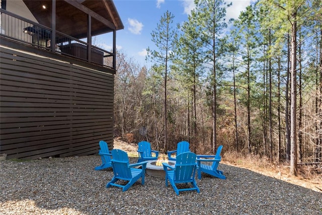 view of yard with an outdoor fire pit