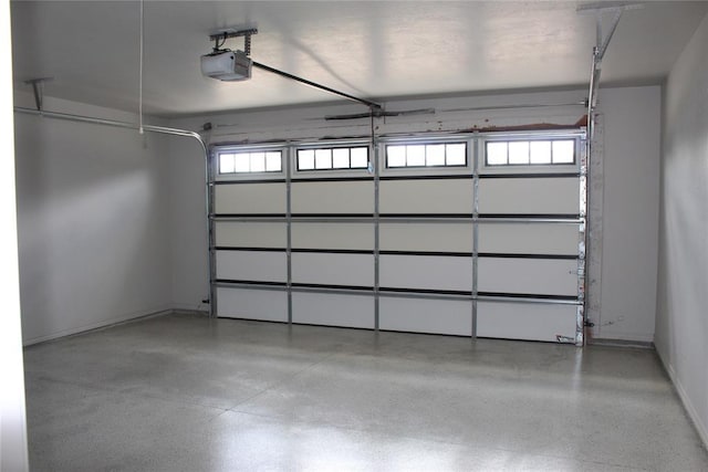 41208 Hazel Dell Rd, Shawnee, OK 74804 - garage featuring a garage door opener and baseboards