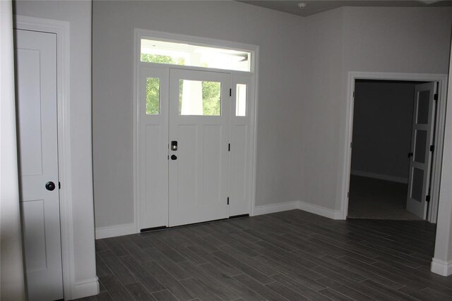 41208 Hazel Dell Rd, Shawnee, OK 74804 - entryway with baseboards and dark wood-style floors