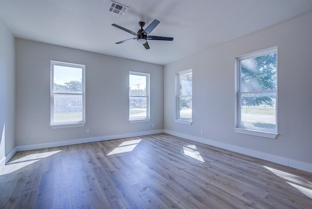 unfurnished room featuring ceiling fan and light wood-type flooring