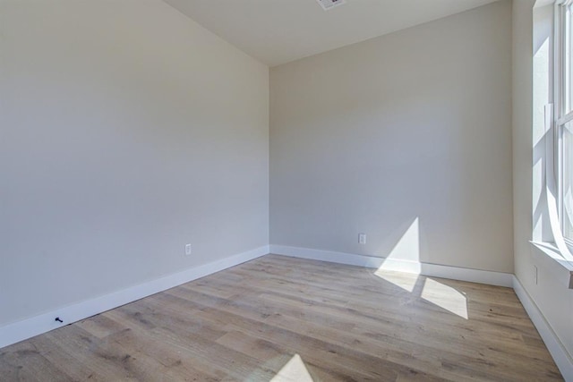 spare room featuring light wood-type flooring