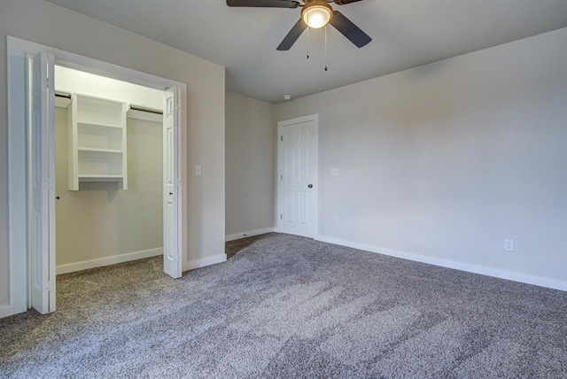 unfurnished bedroom with carpet, a closet, and ceiling fan