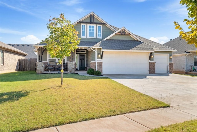 craftsman-style house with a front yard and a garage