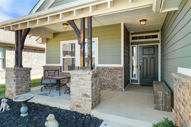 property entrance featuring covered porch