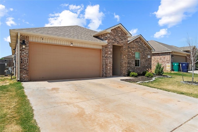 view of front of home with a garage and a front yard