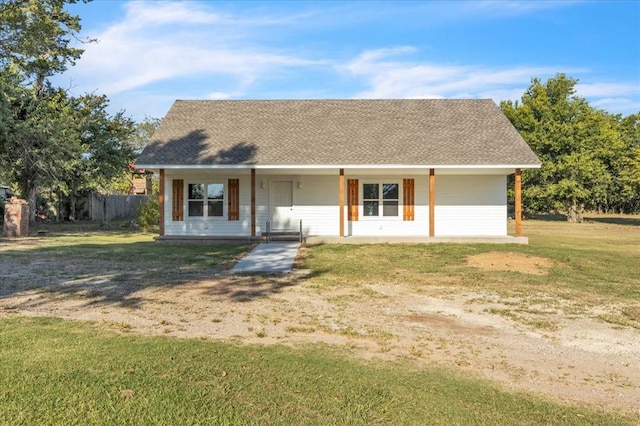 ranch-style home featuring a porch and a front lawn