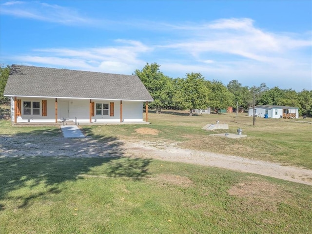 view of yard featuring covered porch