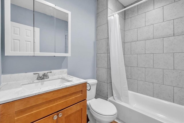 full bathroom with vanity, toilet, and shower / bath combo with shower curtain