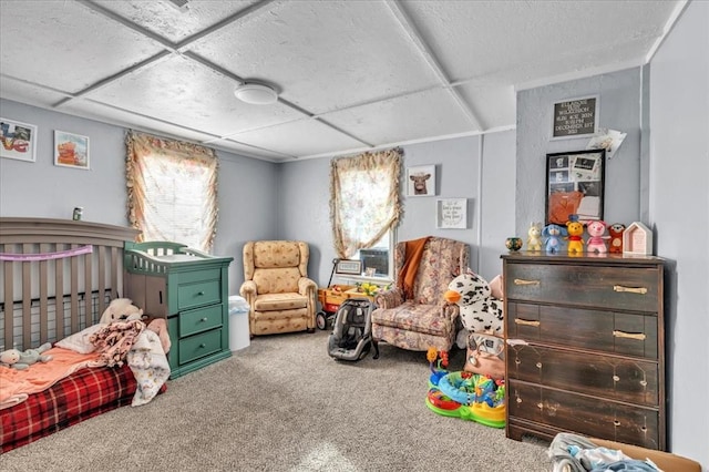 bedroom with a paneled ceiling and carpet floors