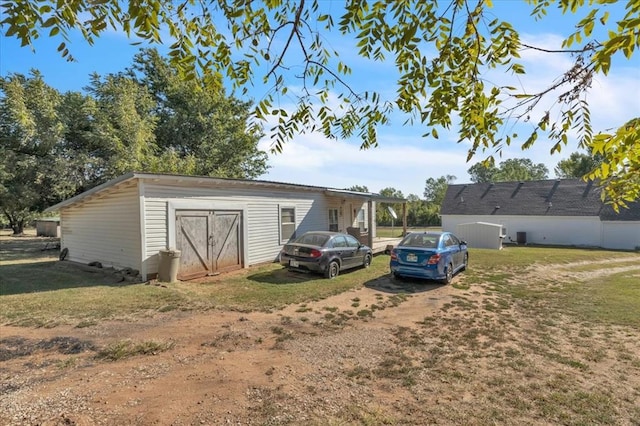 view of outbuilding featuring a yard