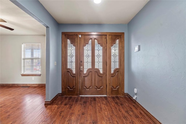 foyer entrance featuring dark hardwood / wood-style floors