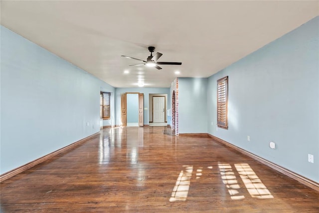 empty room featuring ceiling fan and wood-type flooring