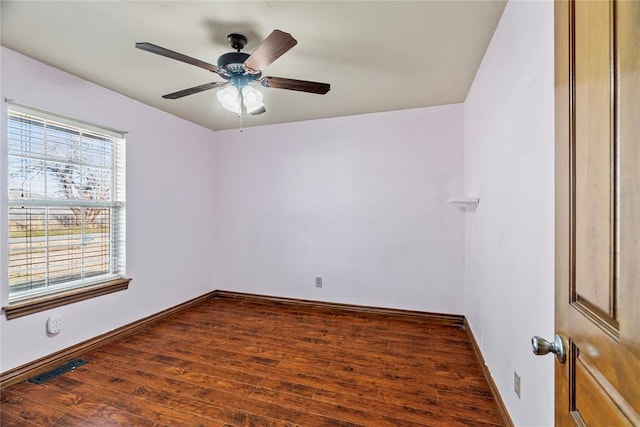 unfurnished room with dark hardwood / wood-style floors