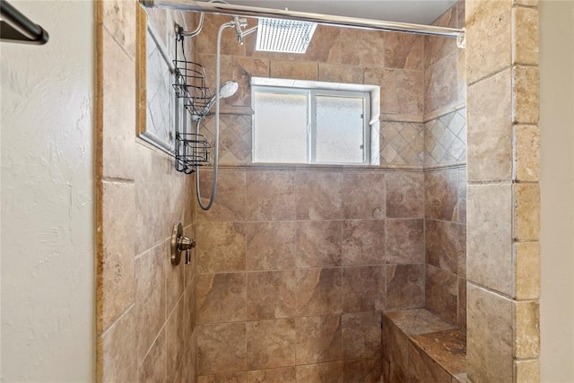 bathroom featuring a tile shower