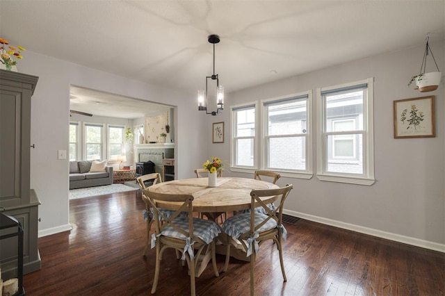 dining room featuring dark hardwood / wood-style flooring and a notable chandelier