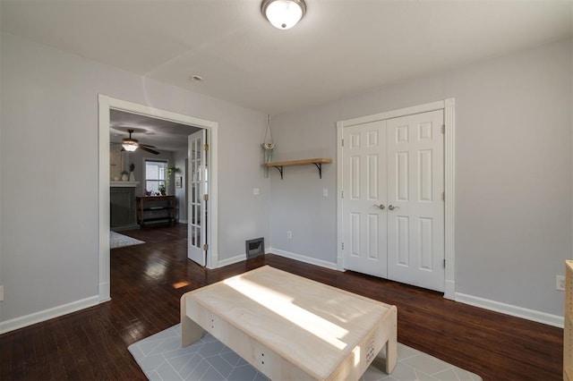 unfurnished bedroom with a closet and dark wood-type flooring