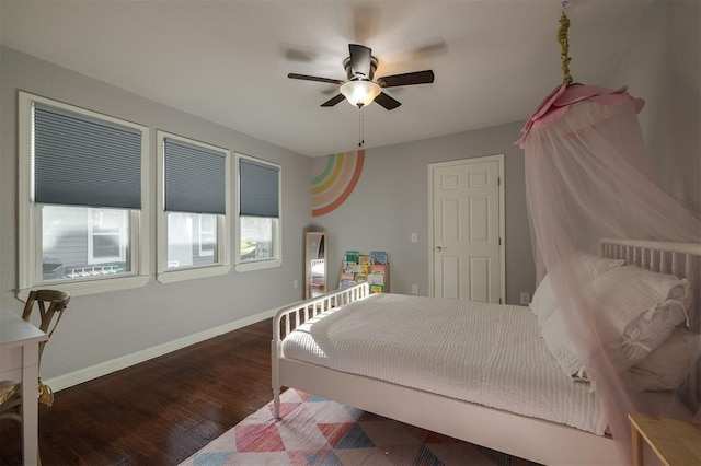 bedroom featuring ceiling fan and dark hardwood / wood-style flooring