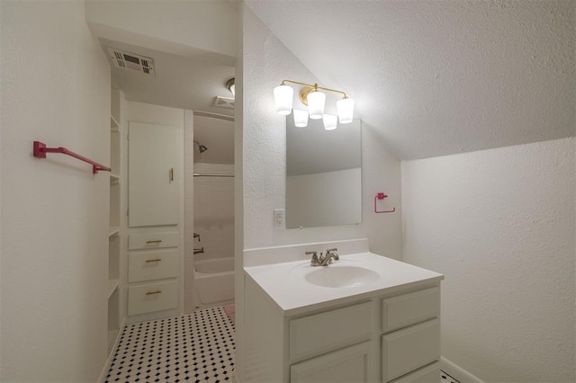 bathroom with vanity and washtub / shower combination