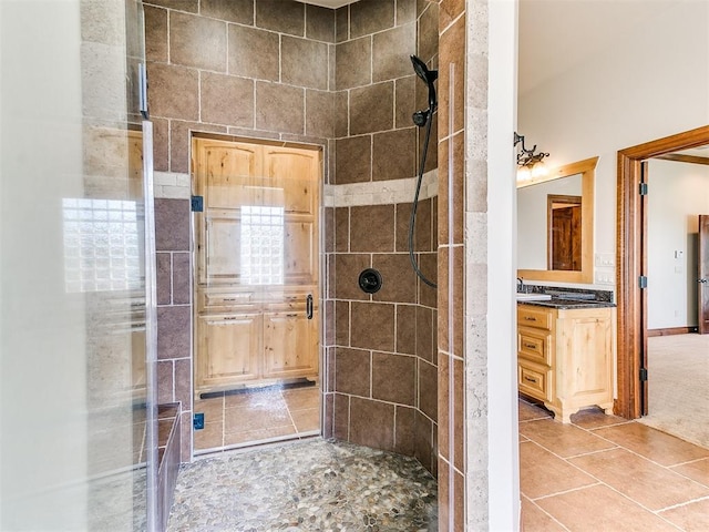 bathroom featuring vanity and an enclosed shower