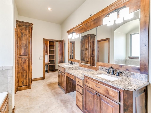 bathroom with vanity and tile walls