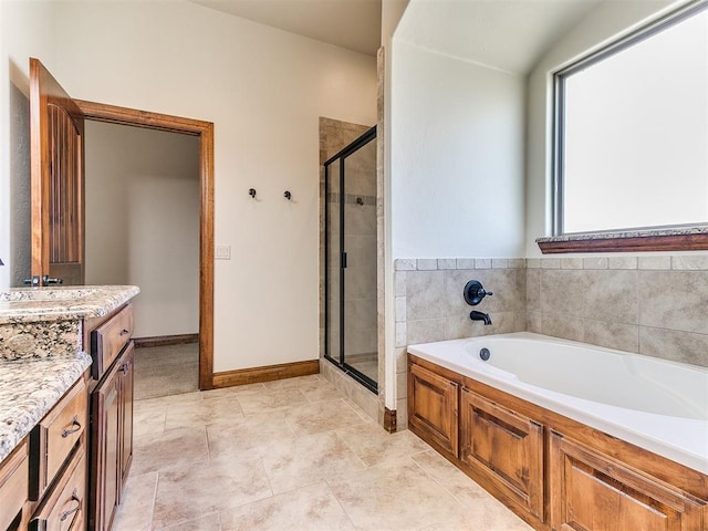 bathroom featuring tile patterned flooring, vanity, and independent shower and bath