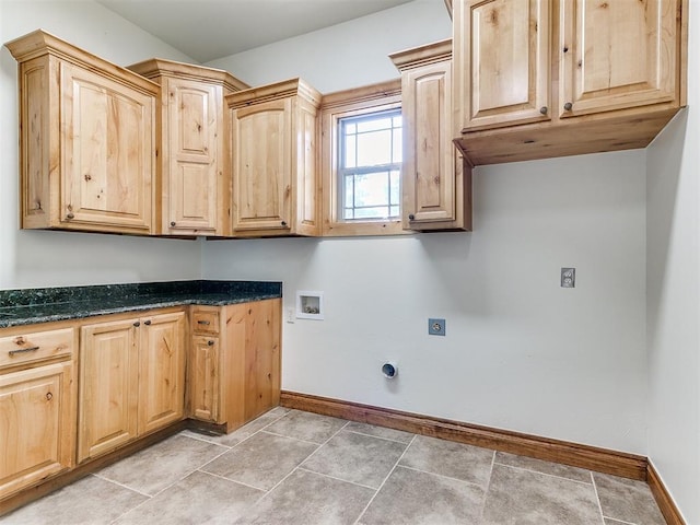 laundry area featuring cabinets, hookup for a washing machine, electric dryer hookup, and light tile patterned flooring