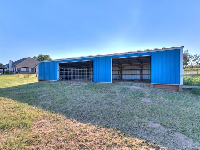 garage featuring a lawn