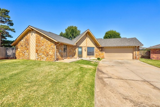 view of front of property featuring a garage and a front lawn