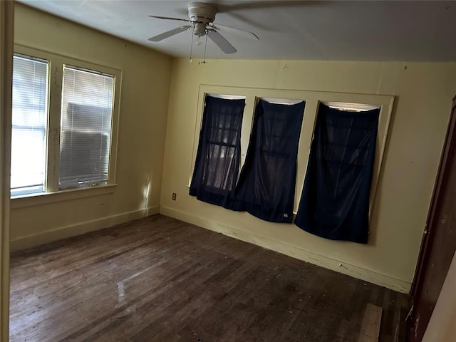 unfurnished room featuring dark hardwood / wood-style floors and ceiling fan