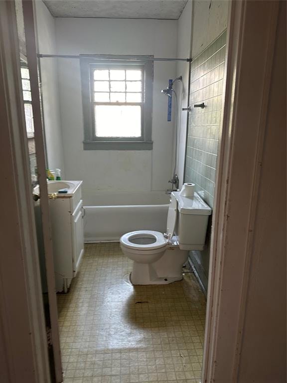 full bathroom featuring shower / tub combination, vanity, tile walls, and toilet