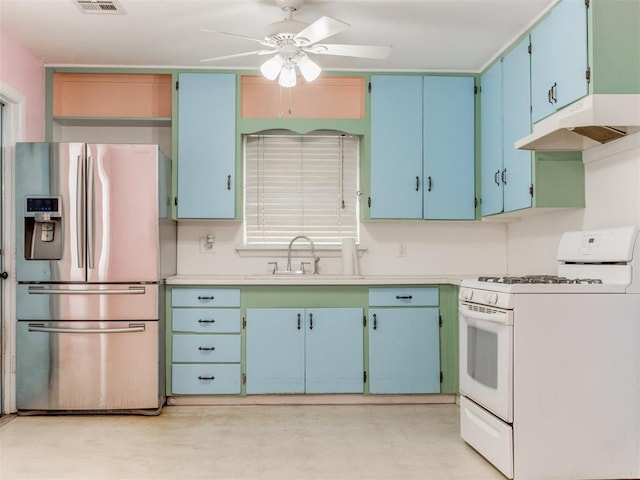 kitchen featuring blue cabinets, light countertops, white gas stove, under cabinet range hood, and stainless steel refrigerator with ice dispenser