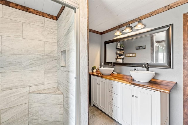 bathroom with vanity, wooden ceiling, and walk in shower