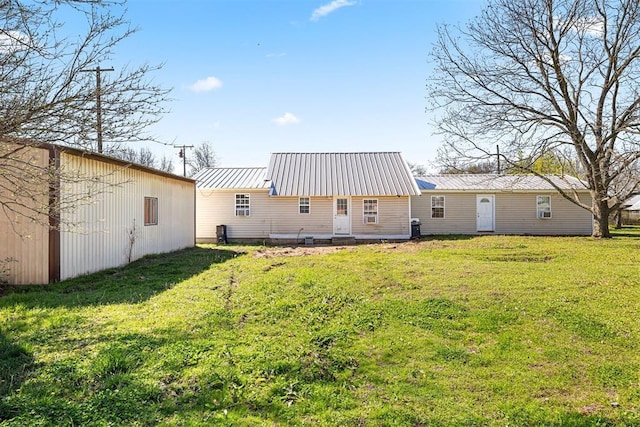 back of house with a yard