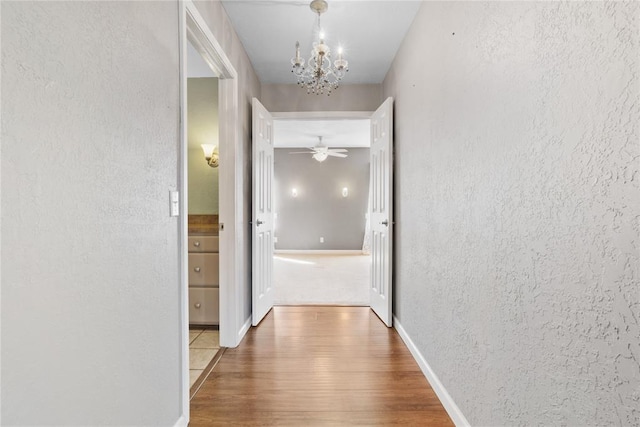 24484 E 990th Rd, Weatherford, OK 73096 - hall with a chandelier and hardwood / wood-style flooring