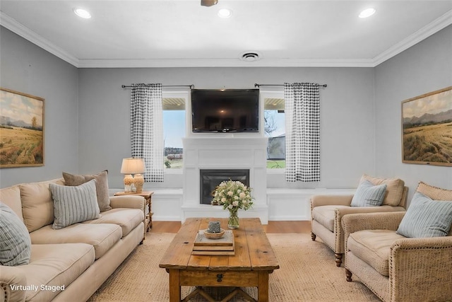 24484 E 990th Rd, Weatherford, OK 73096 - living room featuring light wood-type flooring and ornamental molding