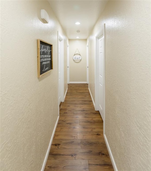 hall featuring dark wood-type flooring