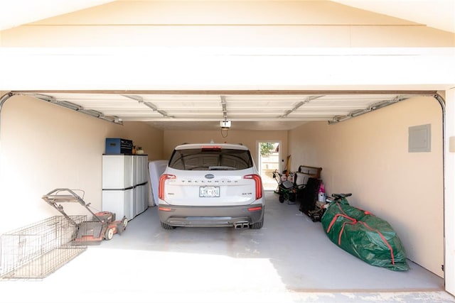 garage featuring a carport and a garage door opener