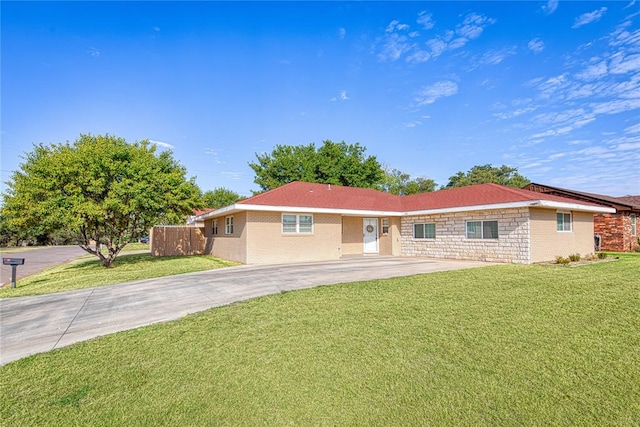 ranch-style house with a front lawn