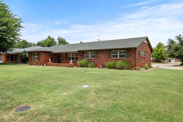 single story home with a front yard